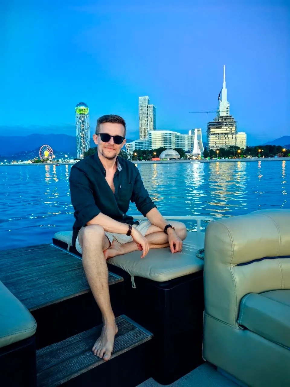 Vitali Wasmann, founder of Marencia, on a boat at dusk